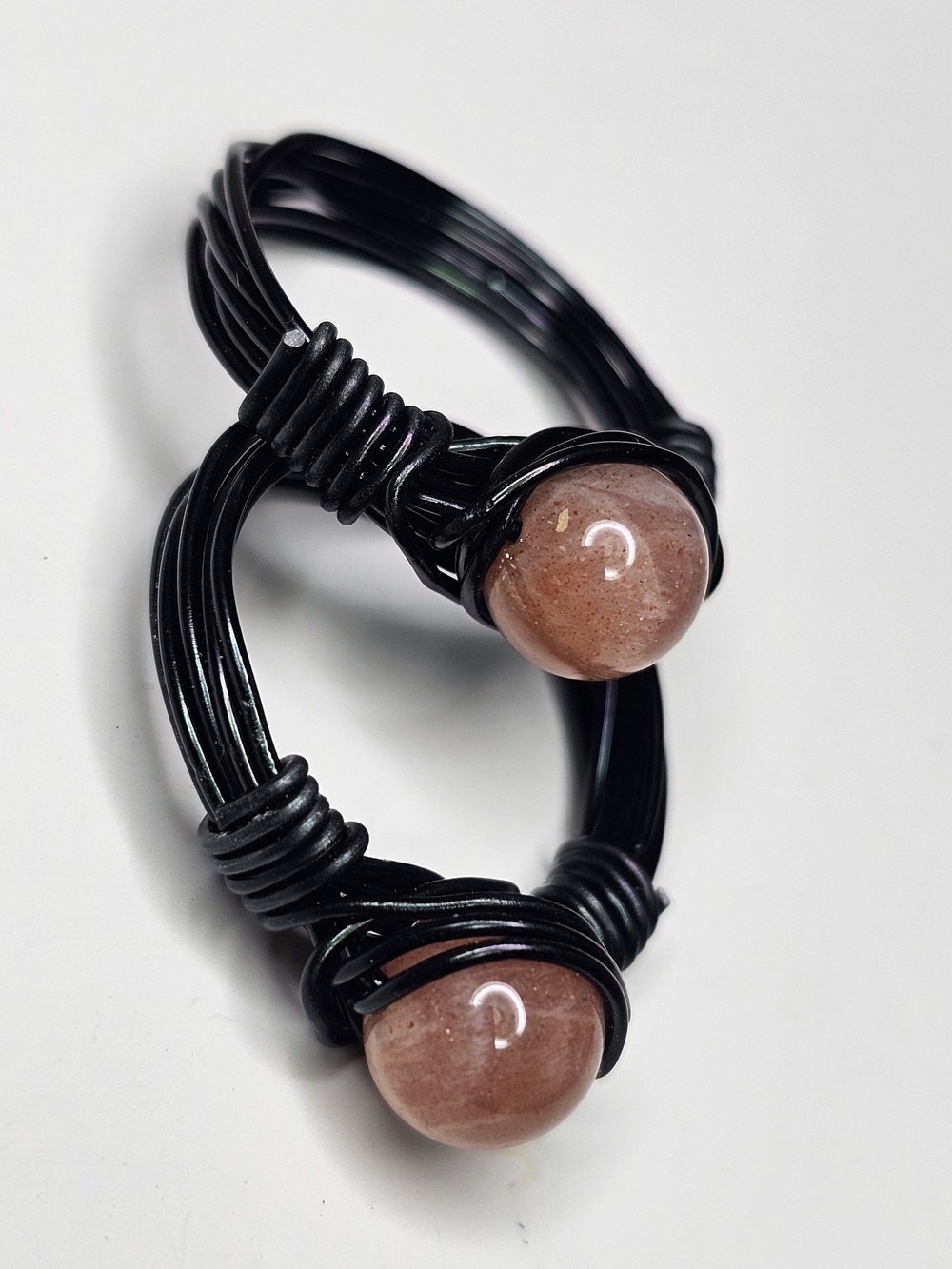 Bundle Of 2 Black Wire Ring with Peach Sun Stone